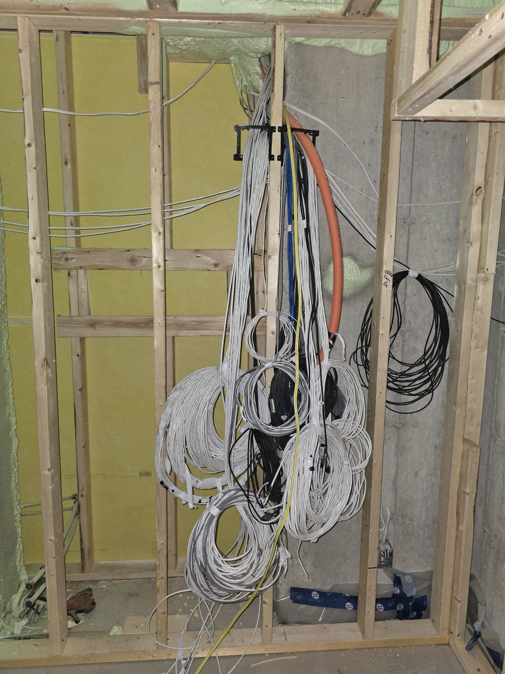 Comparison of wiring accessibility before and after walls are finished during a home renovation